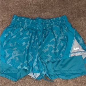Blue athletic shorts with spandex shorts